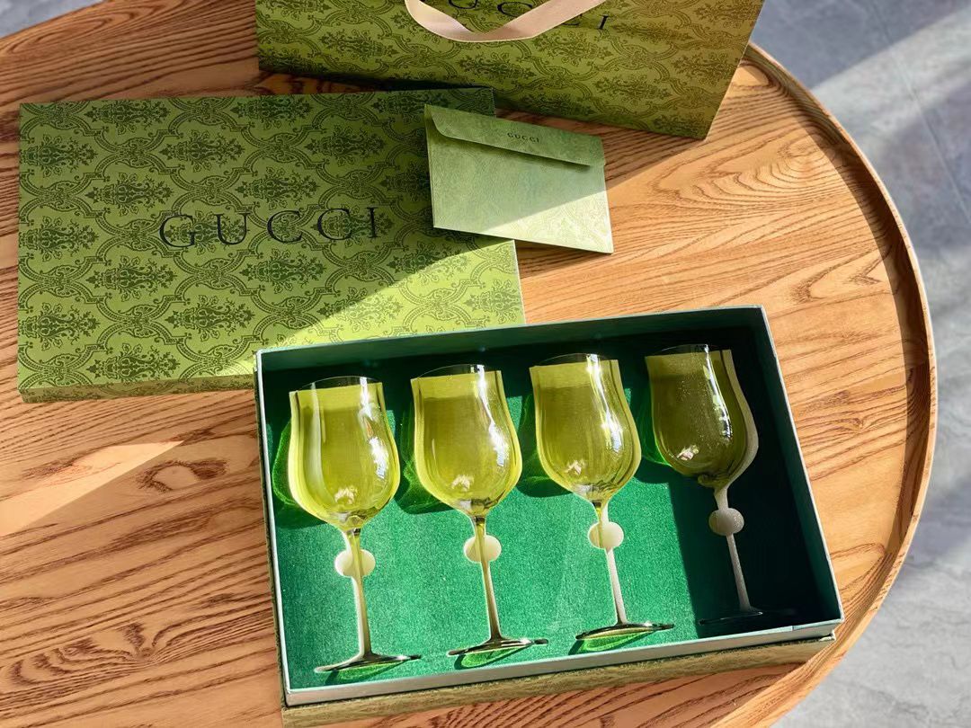 Gucci set of four green glasses 